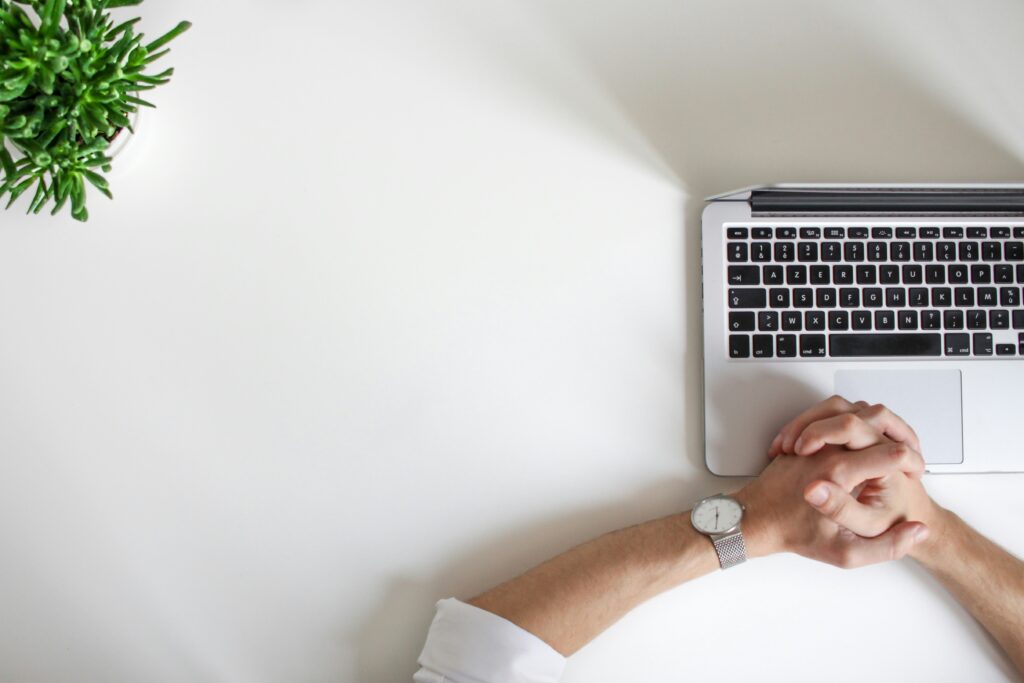 hands on a keyboard on a desk